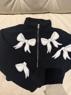 Kids Black Zip-Up Puffer Jacket with White Bow Appliqués